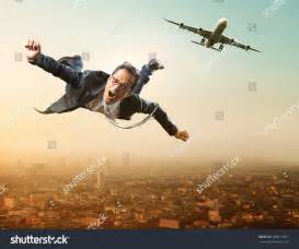 man jumping from plane